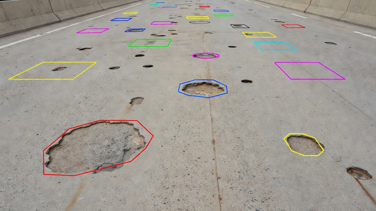 Concrete bridge deck inspection photograph showing multiple spalls and potholes with individual instance segmentation overlays and uniquely color-coded masks